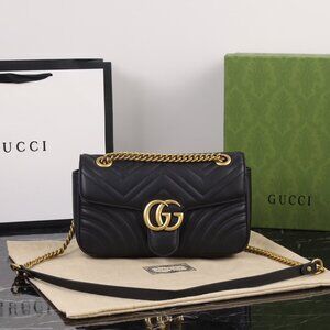 Gucci GG Marmont quilted leather black shoulder bag with gold chain.